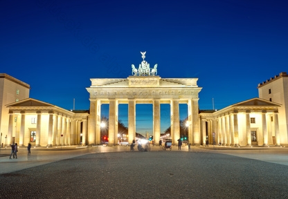 The illiminated Brandenburg Gate at dawn